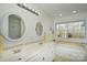 Bright bathroom with double sinks, soaking tub, and a large window with natural light at 623 Roxboro Dr, Mount Gilead, NC 27306