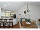 Bright eat-in kitchen area features an adjacent dining room, breakfast bar, and ample natural light at 623 Roxboro Dr, Mount Gilead, NC 27306