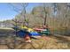 Lakeside kayak storage rack with multiple kayaks, offering convenient access for water activities and recreation at 623 Roxboro Dr, Mount Gilead, NC 27306