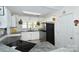 Charming kitchen features white cabinetry, stainless steel appliances, and granite countertops at 623 Roxboro Dr, Mount Gilead, NC 27306