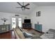 Cozy living room with vaulted ceilings, a ceiling fan, and French doors leading to the outside at 623 Roxboro Dr, Mount Gilead, NC 27306