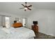 Spacious main bedroom with vaulted ceiling, desk, dresser, and neutral decor at 623 Roxboro Dr, Mount Gilead, NC 27306
