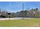 Outdoor recreation area featuring a tennis court and basketball court, perfect for active living and community engagement at 623 Roxboro Dr, Mount Gilead, NC 27306
