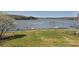 Beautiful waterfront home with boat docks, an American flag and a meticulously maintained lawn and landscaping at 623 Roxboro Dr, Mount Gilead, NC 27306