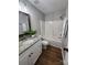 Bathroom with a vanity, large tub, and modern fixtures at 6423 Town Hall Pl, Harrisburg, NC 28075