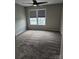 Neutral bedroom features plush carpeting and natural light at 6423 Town Hall Pl, Harrisburg, NC 28075