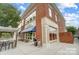 Rocky River Coffee Co. showcases a charming brick exterior and inviting outdoor seating at 6423 Town Hall Pl, Harrisburg, NC 28075