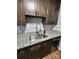 Modern kitchen with granite counters, tile backsplash, and shaker style cabinets at 6423 Town Hall Pl, Harrisburg, NC 28075