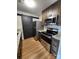 Well-equipped kitchen featuring stainless steel appliances, granite countertops and custom cabinetry at 6423 Town Hall Pl, Harrisburg, NC 28075