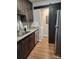 Open kitchen with laundry area featuring barn door access at 6423 Town Hall Pl, Harrisburg, NC 28075