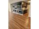 Open-concept floor plan with stylish shelving and durable wood-look flooring at 6423 Town Hall Pl, Harrisburg, NC 28075