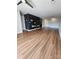 Spacious living room featuring sleek wood flooring and an open-concept layout at 6423 Town Hall Pl, Harrisburg, NC 28075