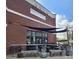 Percent Tap House with an outdoor patio seating area and brick exterior at 6423 Town Hall Pl, Harrisburg, NC 28075