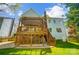 Charming home exterior featuring a multi-level deck with a pergola, a backyard, and access to outdoor spaces at 6519 Summertree Ln, Charlotte, NC 28270