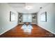 Charming bonus room with beautiful hardwood floors, built in shelving, and serene natural light at 6519 Summertree Ln, Charlotte, NC 28270