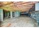 Well-kept crawl space featuring concrete block walls, insulation, and organized utilities at 6519 Summertree Ln, Charlotte, NC 28270