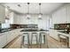 Contemporary kitchen featuring island with seating and ample cabinet space at 6519 Summertree Ln, Charlotte, NC 28270