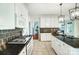 Spacious kitchen with stainless steel appliances and dark granite countertops at 6519 Summertree Ln, Charlotte, NC 28270