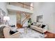 Elegant living room showcasing high ceilings, staircase and refined decor at 6519 Summertree Ln, Charlotte, NC 28270