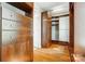 Spacious walk-in closet with wood floors, built-in shelving and drawers for optimal organization and storage at 6519 Summertree Ln, Charlotte, NC 28270