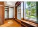 Large walk-in closet with built-in wooden shelving and natural light at 6519 Summertree Ln, Charlotte, NC 28270