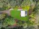 Aerial view of modern home on a spacious lot surrounded by lush greenery and mature trees at 6548 Emerald Isle Dr, Sherrills Ford, NC 28673
