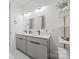 Elegant bathroom offers dual sinks, modern vanity, large mirrors, and sleek lighting fixtures at 6548 Emerald Isle Dr, Sherrills Ford, NC 28673