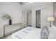 Bedroom featuring modern furnishings, a decorative bed, and access to closet and bathrooms at 6548 Emerald Isle Dr, Sherrills Ford, NC 28673