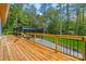 Wood deck overlooking wooded lot and a detached covered parking structure at 6548 Emerald Isle Dr, Sherrills Ford, NC 28673