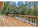 Wood deck overlooking wooded lot and a detached covered parking structure at 6548 Emerald Isle Dr, Sherrills Ford, NC 28673