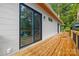 Wooden deck overlooking wooded lot, accessible through sliding glass door at 6548 Emerald Isle Dr, Sherrills Ford, NC 28673