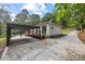 Exterior view of home, showing side entrance, covered parking structure, and wooded lot at 6548 Emerald Isle Dr, Sherrills Ford, NC 28673