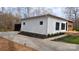 Modern home featuring white horizontal siding, black trim, and a concrete driveway at 6548 Emerald Isle Dr, Sherrills Ford, NC 28673