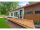 Charming modern home featuring a spacious wood porch and eye-catching curb appeal at 6548 Emerald Isle Dr, Sherrills Ford, NC 28673