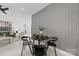 Open-concept living space blending a dining area, living room, and modern design elements at 6548 Emerald Isle Dr, Sherrills Ford, NC 28673