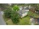 Aerial view of a charming two-story home with a well-manicured lawn and mature trees at 6807 Stoney Ridge Rd, Matthews, NC 28104