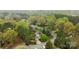 An aerial view of the neighborhood showcases the house's location and surrounding greenery at 6807 Stoney Ridge Rd, Matthews, NC 28104
