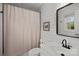 Bathroom with a gray wall, a mirror, a toilet, and a shower with a white curtain at 6807 Stoney Ridge Rd, Matthews, NC 28104
