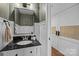 A beautifully remodeled half bathroom with stylish vanity and decorative mirror at 6807 Stoney Ridge Rd, Matthews, NC 28104