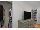 Bedroom featuring a closet and a television set on a gray dresser at 6807 Stoney Ridge Rd, Matthews, NC 28104