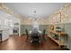 The dining room features charming floral wallpaper, wainscoting, and stylish light fixture at 6807 Stoney Ridge Rd, Matthews, NC 28104