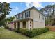 Two-story home featuring brick and siding, green shutters, a well-manicured lawn, and a charming covered front porch at 6807 Stoney Ridge Rd, Matthews, NC 28104