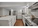 Bright open kitchen featuring white cabinets, stainless steel appliances and lots of counter space at 6807 Stoney Ridge Rd, Matthews, NC 28104