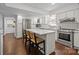 Bright kitchen with stainless steel appliances, quartz countertops and a large island at 6807 Stoney Ridge Rd, Matthews, NC 28104