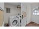 The laundry room features new appliances and storage space at 6807 Stoney Ridge Rd, Matthews, NC 28104