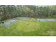 A green sports field featuring tennis and basketball courts for recreation and community activities at 6807 Stoney Ridge Rd, Matthews, NC 28104