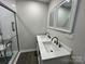 Bathroom featuring a double sink vanity with modern fixtures and a walk-in shower at 8124 Wood St, Mount Pleasant, NC 28124