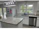 Bright kitchen featuring granite countertops, stainless steel appliances, and a view from the window at 8124 Wood St, Mount Pleasant, NC 28124