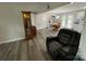 Spacious living room with hardwood floors, a grandfather clock and comfortable seating at 8124 Wood St, Mount Pleasant, NC 28124