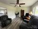 Open floor plan living room, with neutral color palette and plenty of natural light at 8124 Wood St, Mount Pleasant, NC 28124